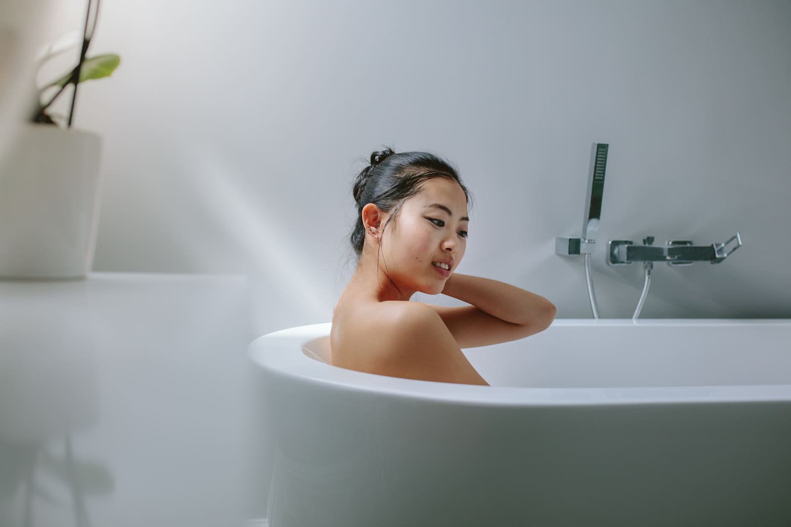 Girl bathing in tub