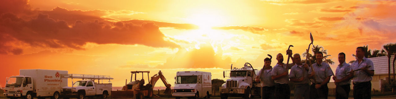 Sun Plumbing trucks sunset background